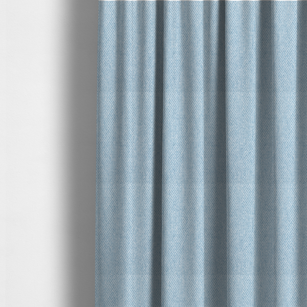 The fabric used to create these made-to-measure curtains is a fabric features a tight, structured basket weave in a soft, airy powder blue.