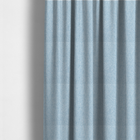 The fabric used to create these made-to-measure curtains is a fabric features a tight, structured basket weave in a soft, airy powder blue.