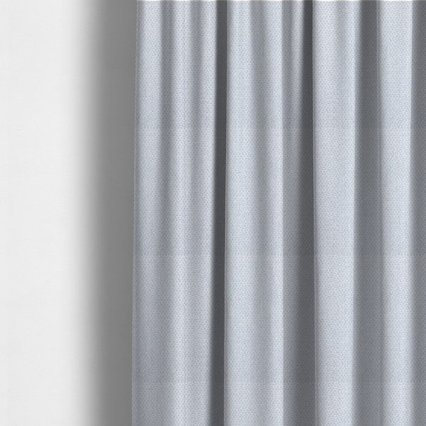 The fabric used to create these made-to-measure curtains is a fabric features a tight, structured basket weave in a sophisticated, cool-toned silver.