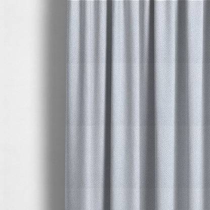 The fabric used to create these made-to-measure curtains is a fabric features a tight, structured basket weave in a sophisticated, cool-toned silver.