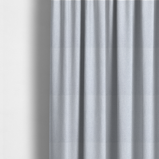 The fabric used to create these made-to-measure curtains is a fabric features a tight, structured basket weave in a sophisticated, cool-toned silver.