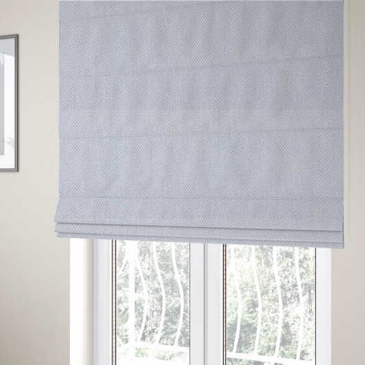 The fabric used to create these Roman blinds is a fabric features a tight, structured basket weave in a sophisticated, cool-toned silver.