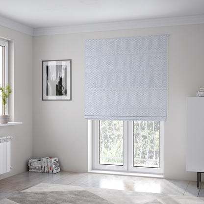 The fabric used to create these Roman blinds is a fabric features a tight, structured basket weave in a sophisticated, cool-toned silver.