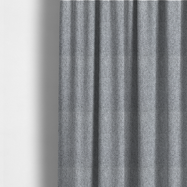 The fabric used to create these made-to-measure curtains is a fabric features a tight, structured basket weave in a versatile, deep charcoal grey.