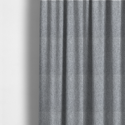 The fabric used to create these made-to-measure curtains is a fabric features a tight, structured basket weave in a versatile, deep charcoal grey.