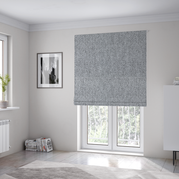 The fabric used to create these Roman blinds is a fabric features a tight, structured basket weave in a versatile, deep charcoal grey.