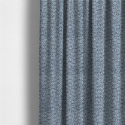 The fabric used to create these made-to-measure curtains is a fabric features a tight, structured basket weave in a versatile, deep steel blue.