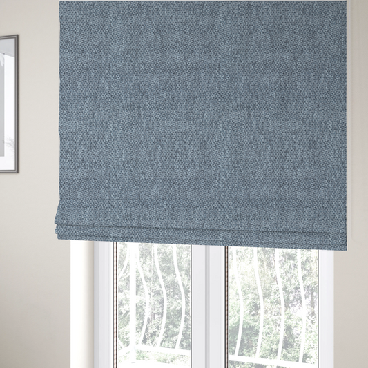 The fabric used to create these Roman blinds is a fabric features a tight, structured basket weave in a versatile, deep steel blue.