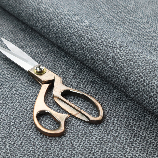 This fabric features a tight, structured basket weave in a versatile, deep charcoal grey.