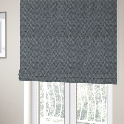 The fabric used to create these Roman blinds is a fabric features a tight, structured basket weave in a versatile, deep charcoal grey.