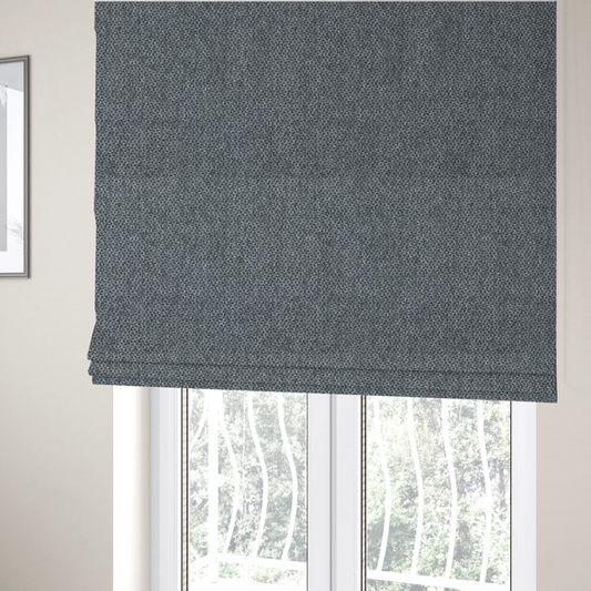The fabric used to create these Roman blinds is a fabric features a tight, structured basket weave in a versatile, deep charcoal grey.