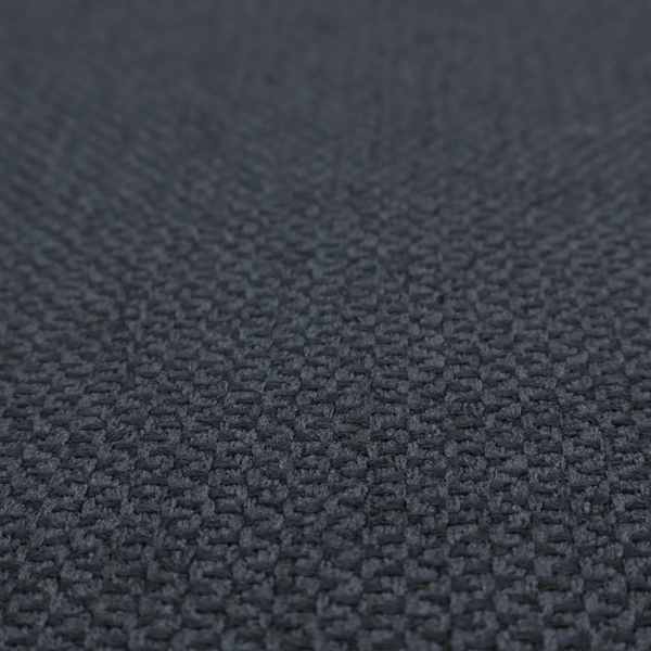 This fabric features a tight, structured basket weave in a deep, moody charcoal or near-black tone.