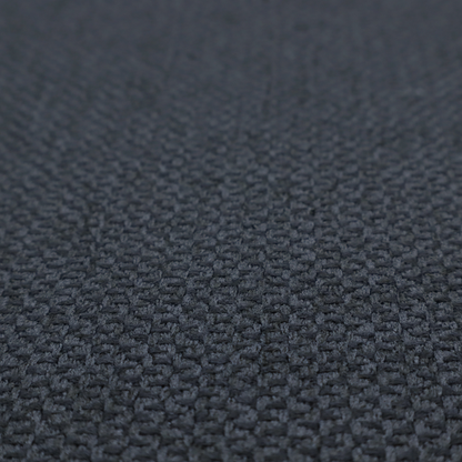 This fabric features a tight, structured basket weave in a deep, moody charcoal or near-black tone.