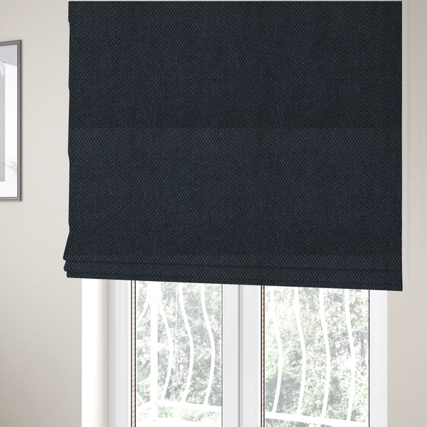 The fabric used to create these Roman blinds is a fabric features a tight, structured basket weave in a deep, moody charcoal or near-black tone.