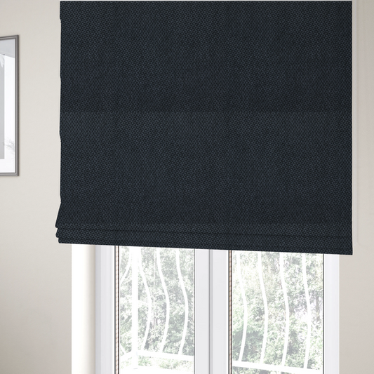 The fabric used to create these Roman blinds is a fabric features a tight, structured basket weave in a deep, moody charcoal or near-black tone.