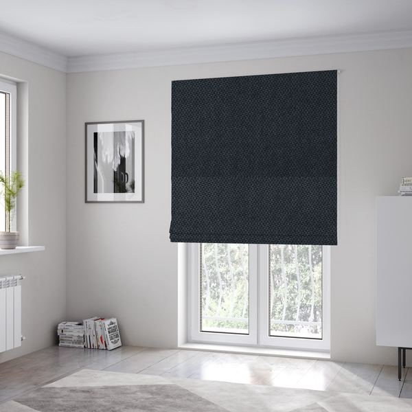 The fabric used to create these Roman blinds is a fabric features a tight, structured basket weave in a deep, moody charcoal or near-black tone.
