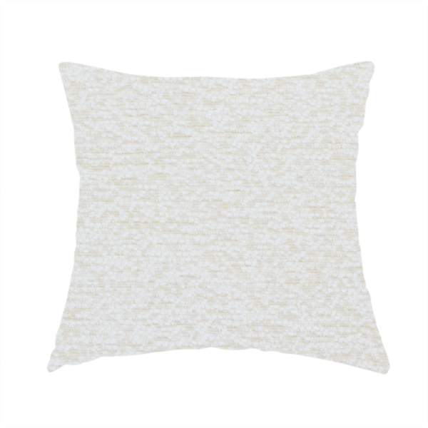 The fabric used to create this handmade cushion is a textured, off-white or cream-coloured weave. It has a bouclé-like or chunky, nubby appearance with a slightly irregular, multidimensional surface that gives it a cosy, organic, and tactile quality.
