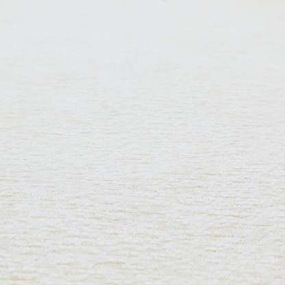 A textured, off-white or cream-coloured weave. It has a bouclé-like or chunky, nubby appearance with a slightly irregular, multidimensional surface that gives it a cosy, organic, and tactile quality.