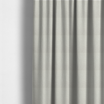 The fabric used to create these made-to-measure curtains is a sophisticated, multi-tonal neutral weave. It features a blend of cream, beige, and soft taupe threads, creating a subtle, heathered effect.
