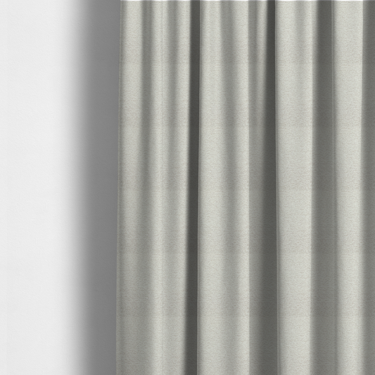 The fabric used to create these made-to-measure curtains is a sophisticated, multi-tonal neutral weave. It features a blend of cream, beige, and soft taupe threads, creating a subtle, heathered effect.