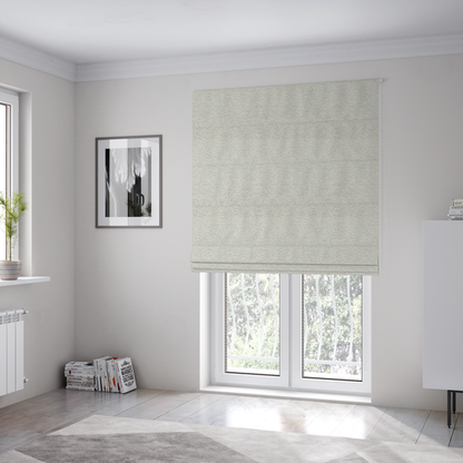 The fabric used to create these Roman blinds is a sophisticated, multi-tonal neutral weave. It features a blend of cream, beige, and soft taupe threads, creating a subtle, heathered effect.