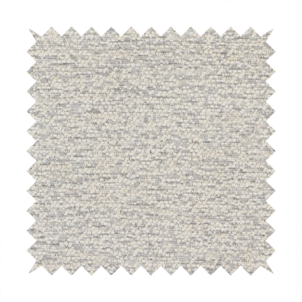 A sophisticated, two-tone textured weave that blends cool grey and soft cream yarns.