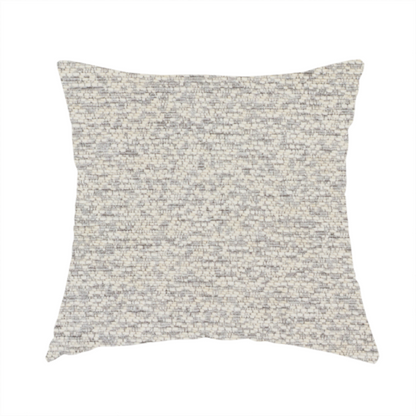 The fabric used to create this handmade cushion is a sophisticated, two-tone textured weave that blends cool grey and soft cream yarns.
