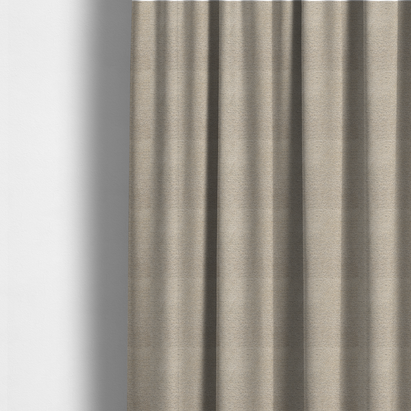 The fabric used to create these made-to-measure curtains is a warm, earthy neutral weave that masterfully blends light cream, tan, and soft grey tones. It has a complex, nubby texture with an intricate, multidimensional surface that feels both substantial and inviting.