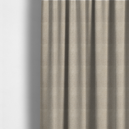 The fabric used to create these made-to-measure curtains is a warm, earthy neutral weave that masterfully blends light cream, tan, and soft grey tones. It has a complex, nubby texture with an intricate, multidimensional surface that feels both substantial and inviting.
