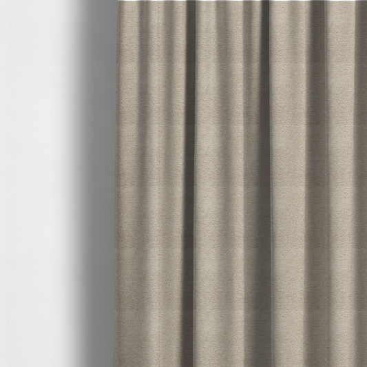 The fabric used to create these made-to-measure curtains is a warm, earthy neutral weave that masterfully blends light cream, tan, and soft grey tones. It has a complex, nubby texture with an intricate, multidimensional surface that feels both substantial and inviting.