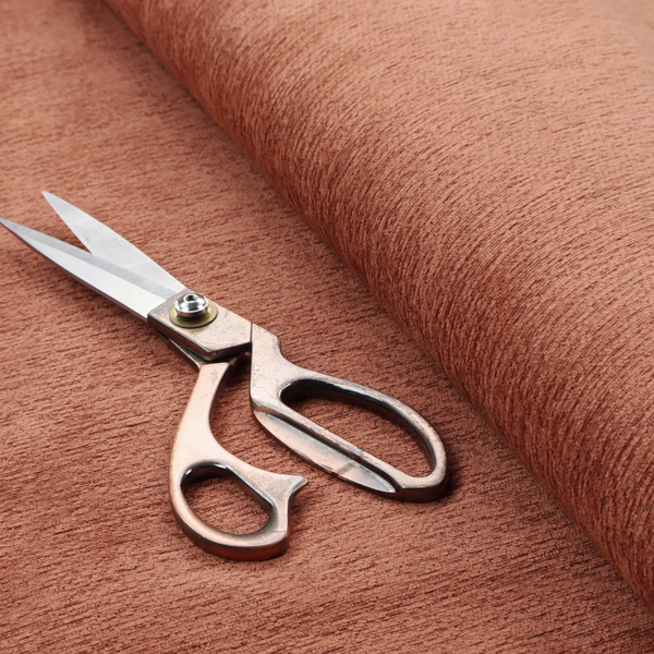 A vibrant, warm terracotta or rust-coloured weave. It features a dense, structured texture with horizontal ribbing and a consistent, slightly nubby finish that adds depth and character.