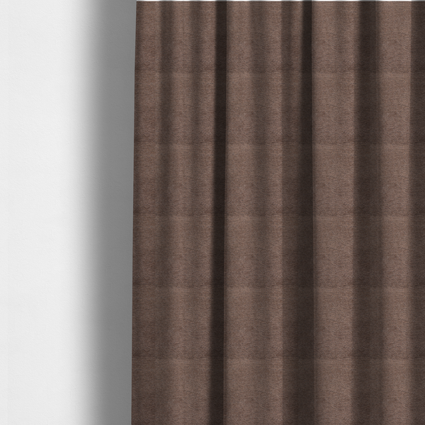 The fabric used to create these made-to-measure curtains is a rich, deep chocolate-brown weave with a sophisticated, textured finish. It is crafted with a dense, nubby construction that creates a subtle horizontal ribbing effect, providing both visual depth and a tactile, grounded feel.