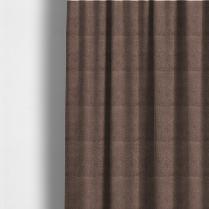 The fabric used to create these made-to-measure curtains is a rich, deep chocolate-brown weave with a sophisticated, textured finish. It is crafted with a dense, nubby construction that creates a subtle horizontal ribbing effect, providing both visual depth and a tactile, grounded feel.