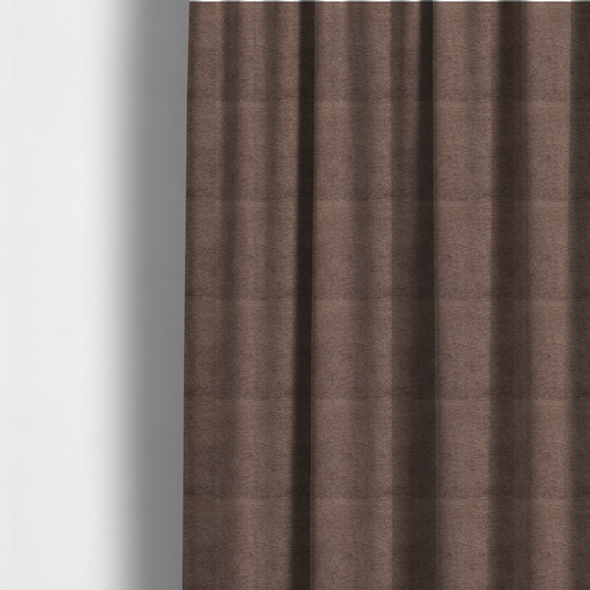 The fabric used to create these made-to-measure curtains is a rich, deep chocolate-brown weave with a sophisticated, textured finish. It is crafted with a dense, nubby construction that creates a subtle horizontal ribbing effect, providing both visual depth and a tactile, grounded feel.