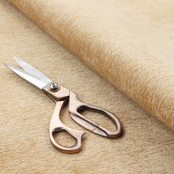 A warm, golden-beige weave with a sophisticated, textured finish. It is crafted with a dense, nubby construction that creates a subtle horizontal ribbing effect, providing both visual depth and a tactile, inviting feel.