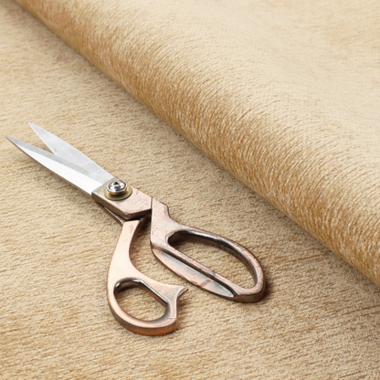 A warm, golden-beige weave with a sophisticated, textured finish. It is crafted with a dense, nubby construction that creates a subtle horizontal ribbing effect, providing both visual depth and a tactile, inviting feel.