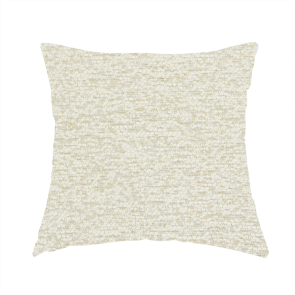 The fabric used to create this handmade cushion is a light, creamy ivory weave with a refined, textured appearance. It is crafted with a dense, nubby construction that creates a subtle horizontal ribbing effect, providing both visual dimension and a soft, tactile quality.