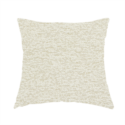 The fabric used to create this handmade cushion is a light, creamy ivory weave with a refined, textured appearance. It is crafted with a dense, nubby construction that creates a subtle horizontal ribbing effect, providing both visual dimension and a soft, tactile quality.