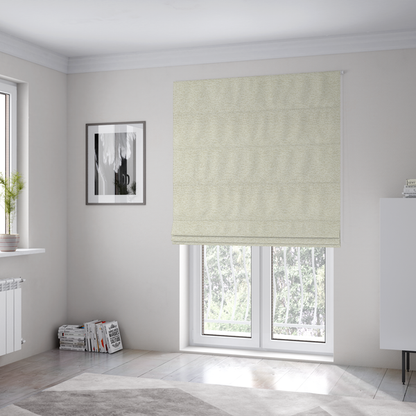 The fabric used to create these Roman blinds is a light, creamy ivory weave with a refined, textured appearance. It is crafted with a dense, nubby construction that creates a subtle horizontal ribbing effect, providing both visual dimension and a soft, tactile quality.