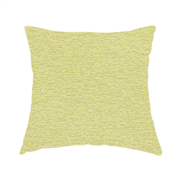 The fabric used to create this handmade cushion is a fresh, vibrant chartreuse-green weave with a sophisticated, textured finish. It is crafted with a dense, nubby construction that creates a subtle horizontal ribbing effect, providing both visual dimension and a soft, inviting tactile quality.