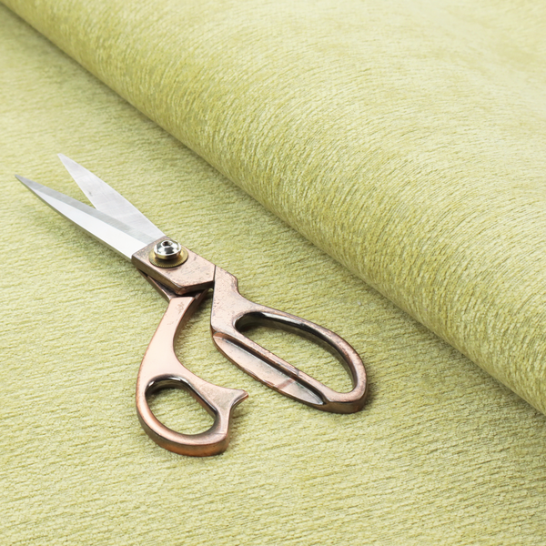 a fresh, vibrant chartreuse-green weave with a sophisticated, textured finish. It is crafted with a dense, nubby construction that creates a subtle horizontal ribbing effect, providing both visual dimension and a soft, inviting tactile quality.