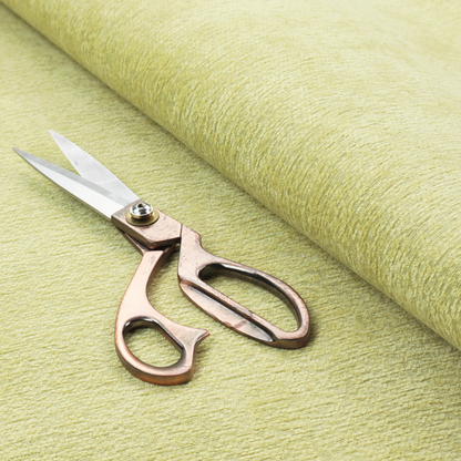 a fresh, vibrant chartreuse-green weave with a sophisticated, textured finish. It is crafted with a dense, nubby construction that creates a subtle horizontal ribbing effect, providing both visual dimension and a soft, inviting tactile quality.