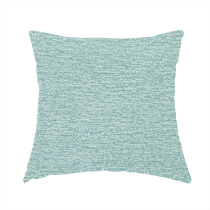 The fabric used to create these handmade cushions is a serene, cool-toned seafoam or soft teal weave with a sophisticated, textured finish.
