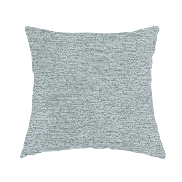 The fabric used to create this handmade cushion is a sophisticated, cool-toned sage green weave with a refined, textured finish. It is crafted with a dense, nubby construction that creates a subtle horizontal ribbing effect, providing both visual dimension and a soft, inviting tactile quality.