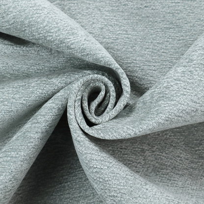 A sophisticated, cool-toned sage green weave with a refined, textured finish. It is crafted with a dense, nubby construction that creates a subtle horizontal ribbing effect, providing both visual dimension and a soft, inviting tactile quality.