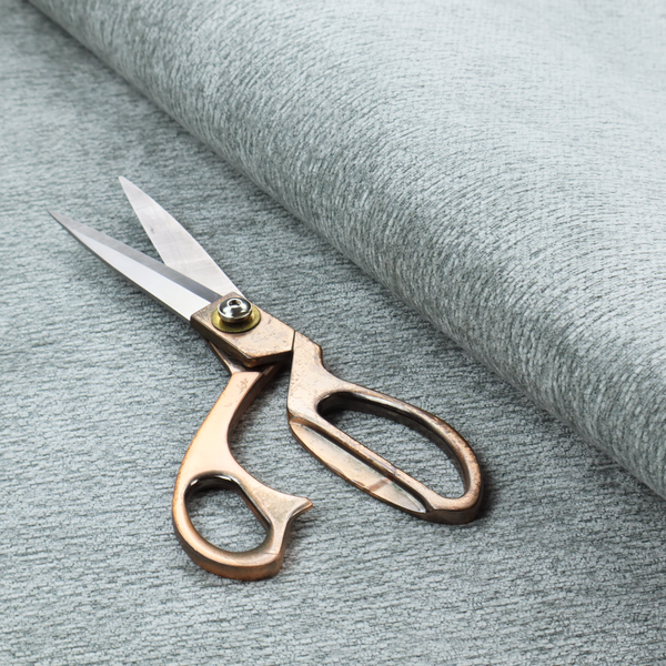A sophisticated, cool-toned sage green weave with a refined, textured finish. It is crafted with a dense, nubby construction that creates a subtle horizontal ribbing effect, providing both visual dimension and a soft, inviting tactile quality.