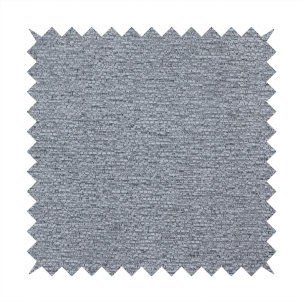 A sophisticated, deep charcoal and slate-grey weave. It features a dense, nubby construction that creates an intricate horizontal ribbing effect, providing significant visual depth and a substantial, inviting tactile quality.