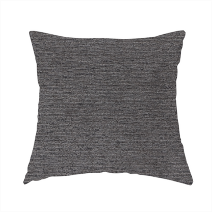 The fabric used to create this handmade cushion is a deep, sophisticated charcoal-grey weave. It is constructed with a dense, nubby texture that creates a subtle, consistent horizontal ribbing effect, providing significant visual depth and a substantial, premium feel.