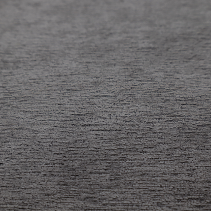 A deep, sophisticated charcoal-grey weave. It is constructed with a dense, nubby texture that creates a subtle, consistent horizontal ribbing effect, providing significant visual depth and a substantial, premium feel.