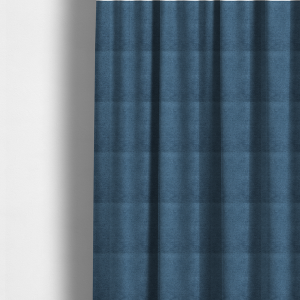 The fabric used to create these made-to-measure curtains is a rich, deep navy-blue weave with a sophisticated, textured finish. It is crafted with a dense, nubby construction that creates a subtle horizontal ribbing effect, providing both visual dimension and a substantial, premium feel.